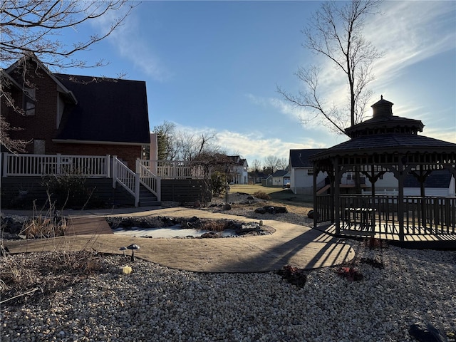 view of yard with a gazebo and a deck