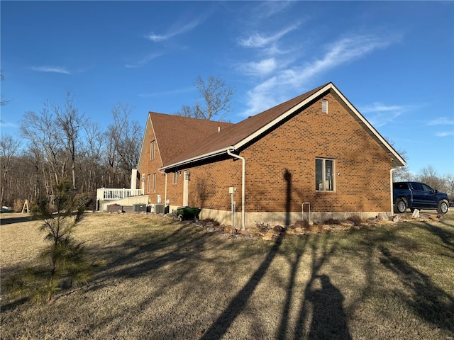 view of home's exterior with a yard