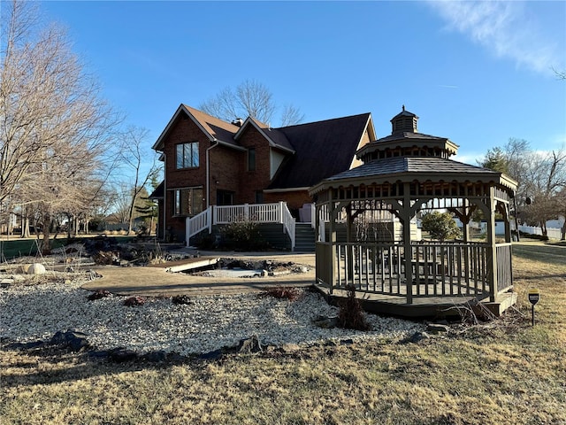 dock area featuring a gazebo and a deck