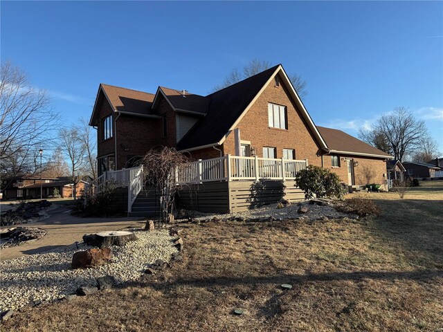 view of side of home featuring a porch