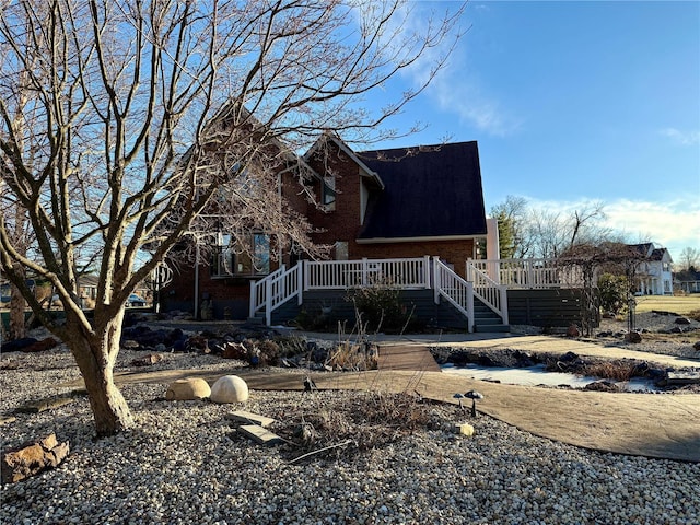 back of property featuring a wooden deck