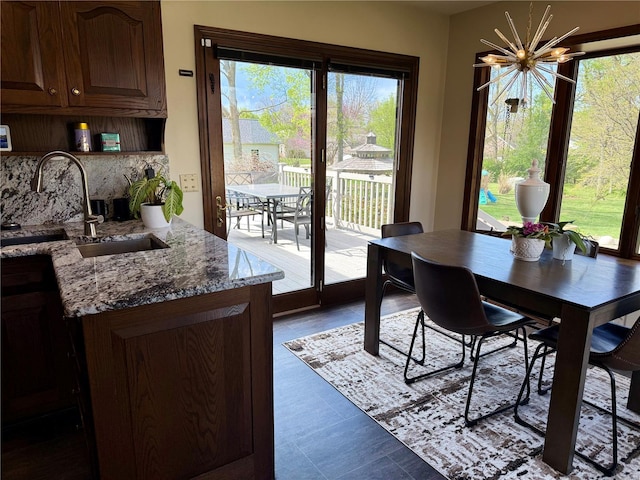 dining space featuring an inviting chandelier