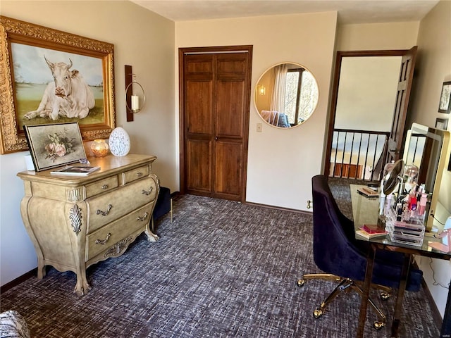 interior space featuring baseboards and carpet
