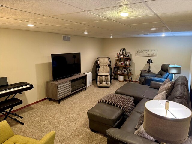 living area with recessed lighting, visible vents, light colored carpet, and a paneled ceiling