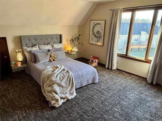 bedroom featuring carpet flooring and lofted ceiling