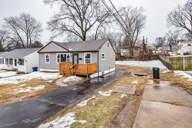 bungalow-style house with a deck