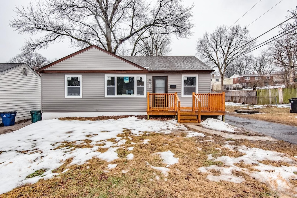 view of front of property featuring a wooden deck