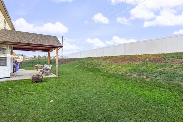 view of yard featuring a patio and a fire pit