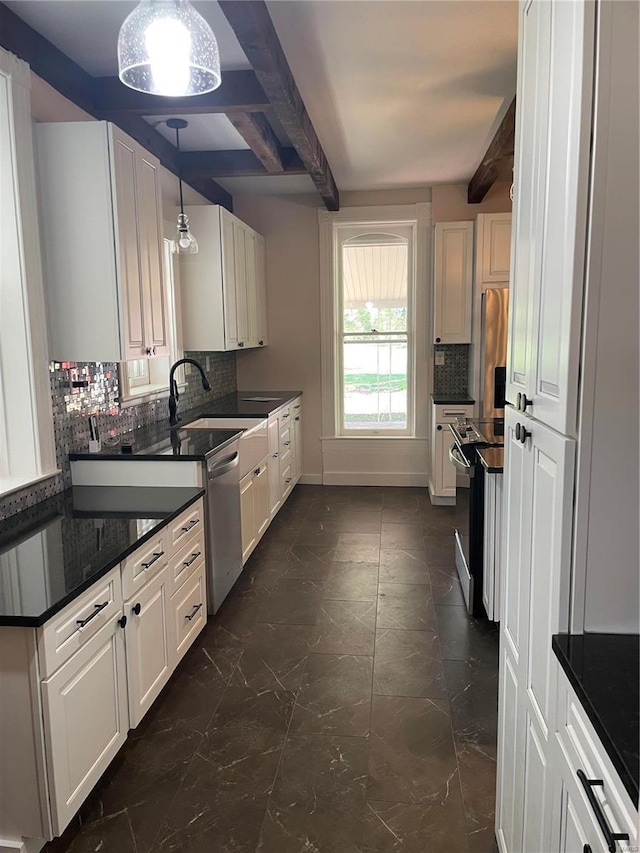 kitchen featuring white cabinetry, hanging light fixtures, stainless steel appliances, and beamed ceiling