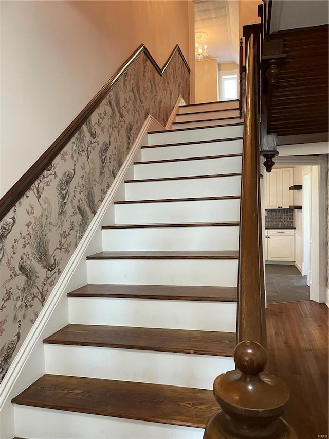 staircase with hardwood / wood-style flooring