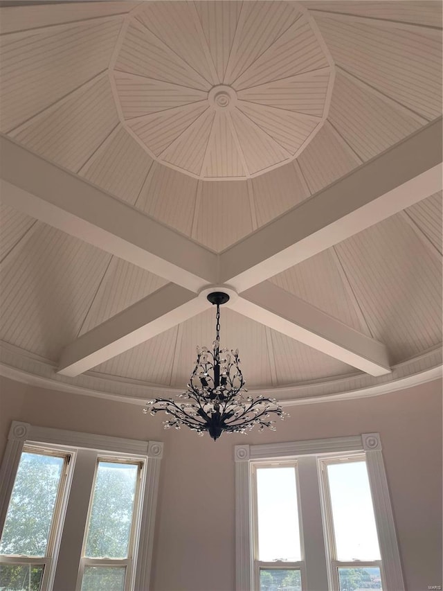 interior details featuring a notable chandelier and beam ceiling