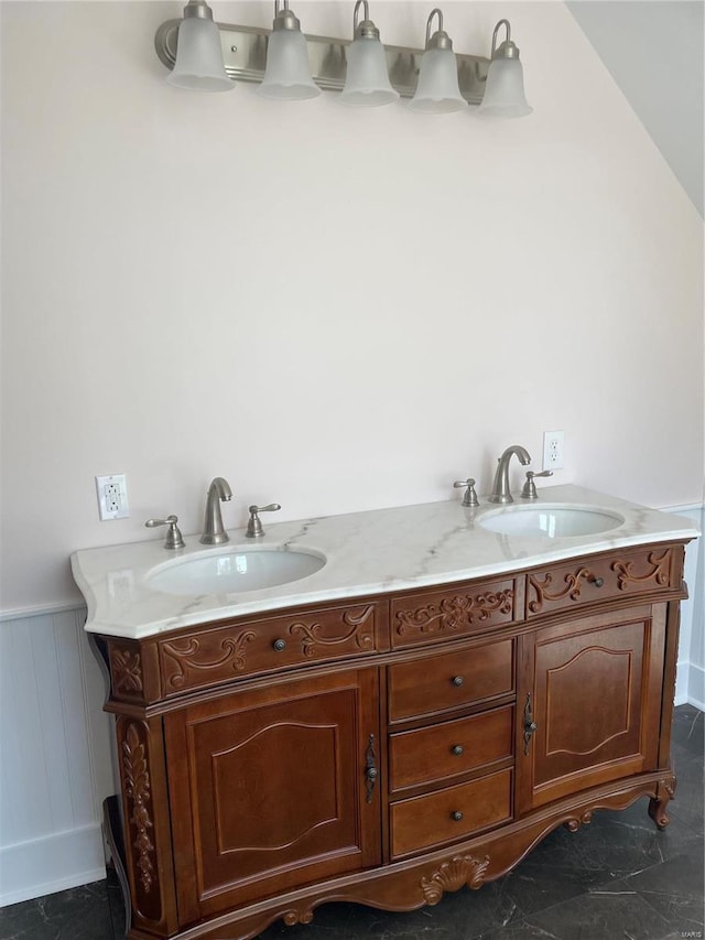 bathroom with vanity and vaulted ceiling