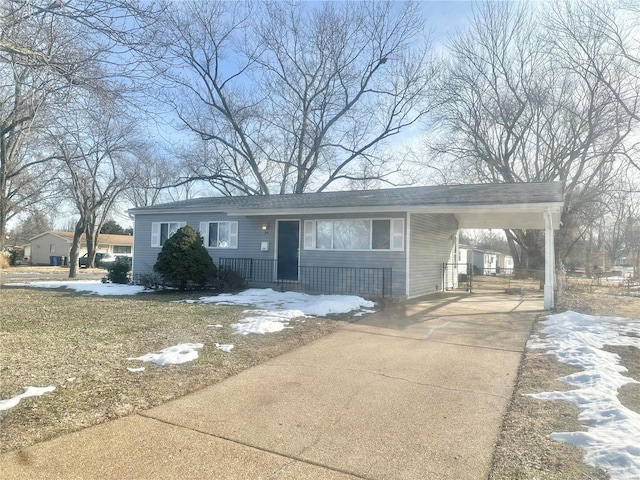 view of front of property featuring a carport