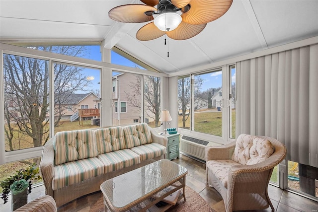 sunroom / solarium featuring ceiling fan and vaulted ceiling with beams