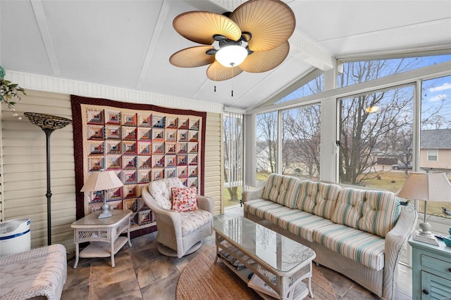 living room featuring ceiling fan and lofted ceiling with beams