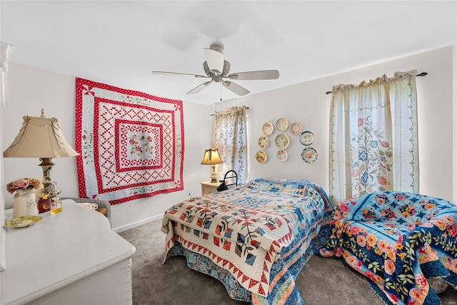 bedroom with ceiling fan and carpet floors