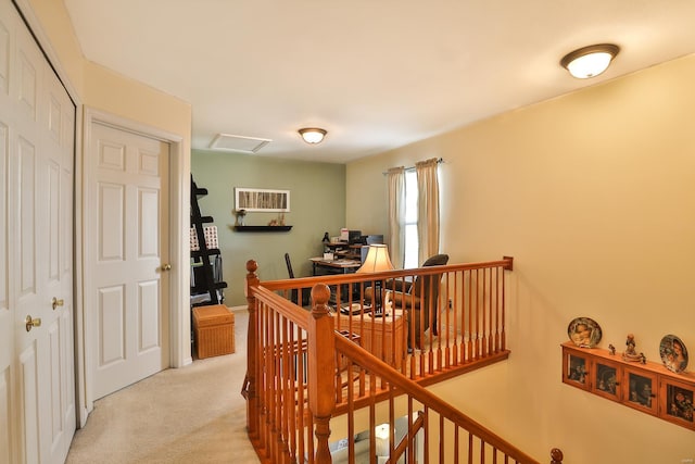 hallway with light carpet