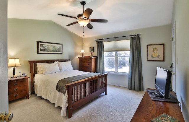 bedroom featuring vaulted ceiling, light colored carpet, and ceiling fan