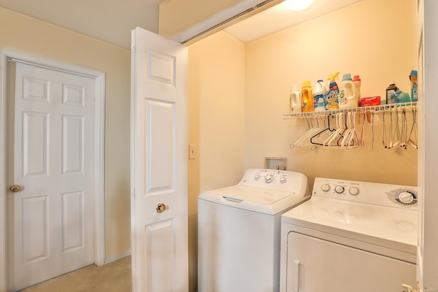 washroom with light carpet and washing machine and clothes dryer