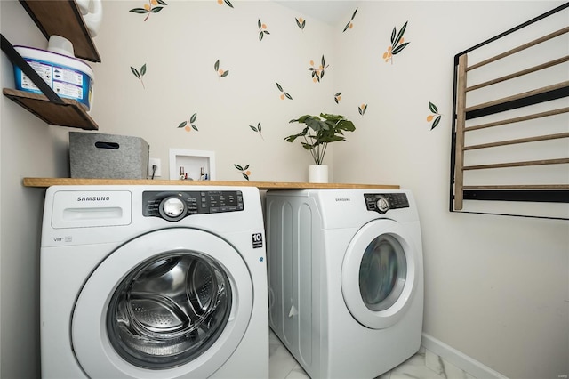 clothes washing area featuring washing machine and clothes dryer