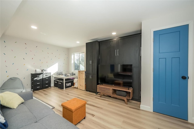 living room with light hardwood / wood-style floors