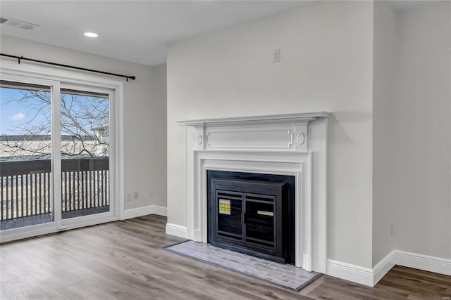 unfurnished living room with light hardwood / wood-style flooring