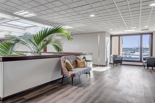 sitting room with hardwood / wood-style floors