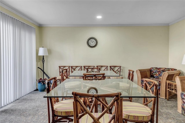 carpeted dining space featuring crown molding