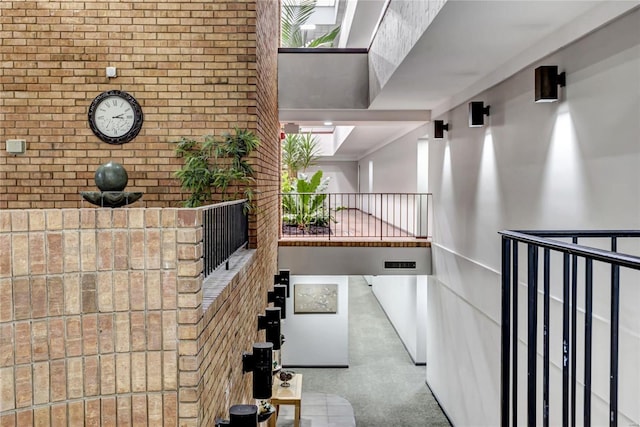 hallway with brick wall