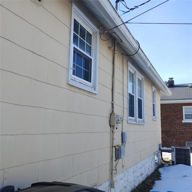 view of side of property with central AC