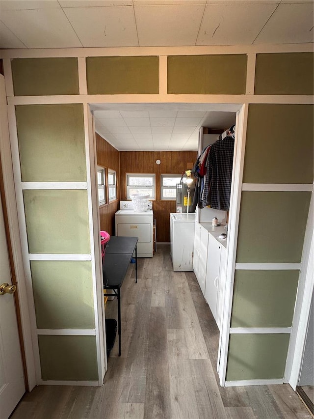 washroom featuring hardwood / wood-style flooring and wood walls