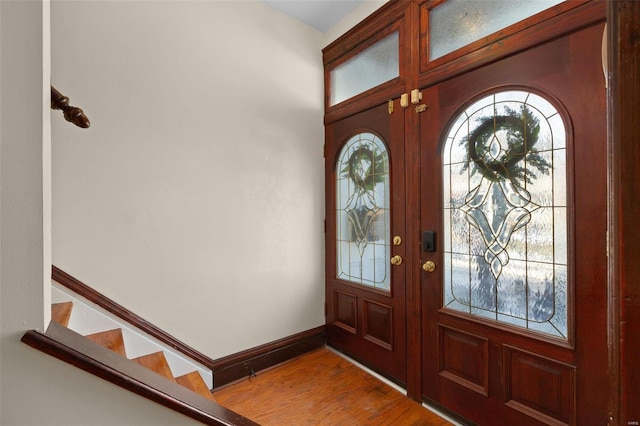 foyer entrance featuring french doors and hardwood / wood-style floors