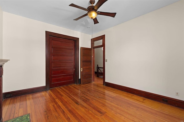 unfurnished bedroom featuring hardwood / wood-style flooring and ceiling fan