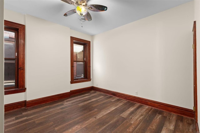 unfurnished room featuring ceiling fan and dark hardwood / wood-style flooring