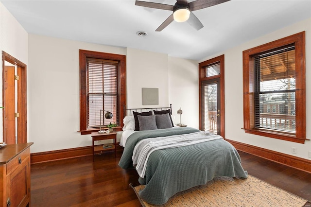 bedroom featuring dark hardwood / wood-style flooring and ceiling fan