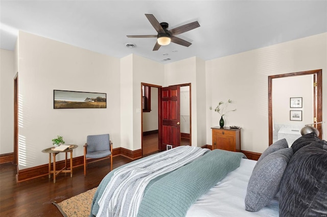 bedroom with ceiling fan and dark hardwood / wood-style flooring