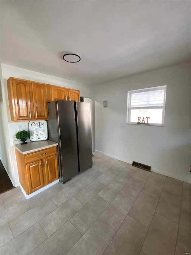 kitchen featuring stainless steel fridge