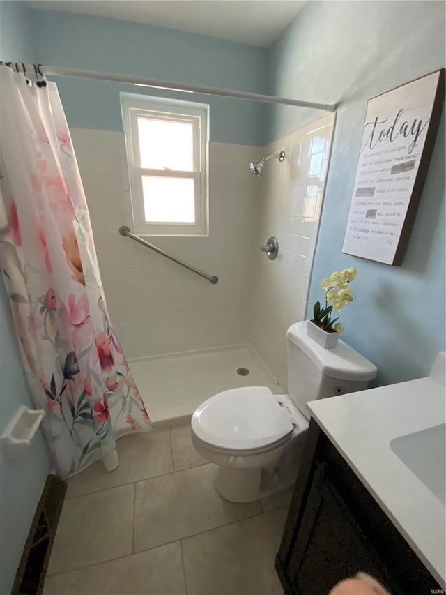 bathroom with vanity, toilet, tile patterned flooring, and a shower with shower curtain