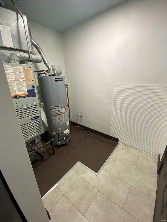 utility room with gas water heater