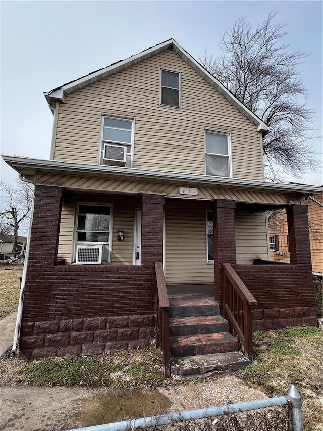 view of front of house featuring cooling unit and covered porch