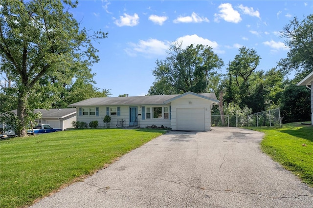 single story home with a garage and a front lawn