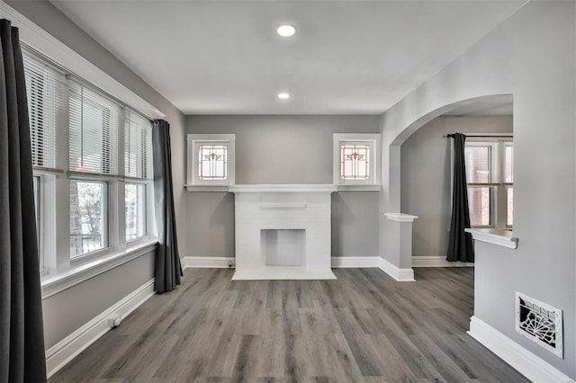 unfurnished living room with hardwood / wood-style floors