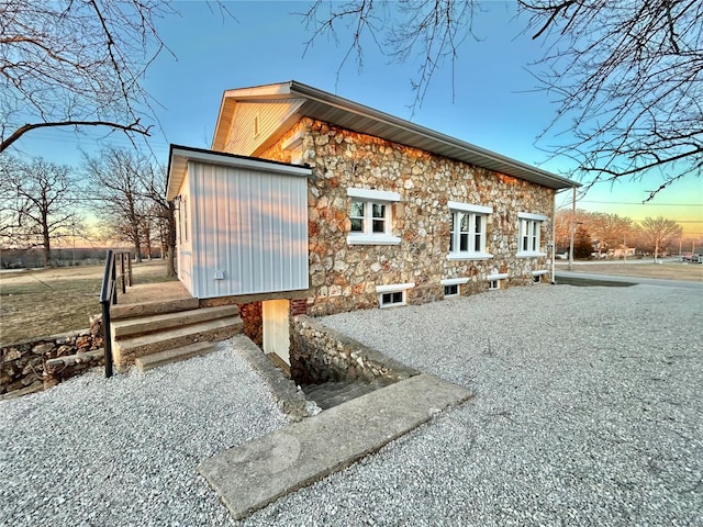 view of back house at dusk