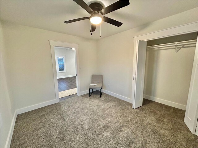 unfurnished bedroom with carpet, ceiling fan, and a closet