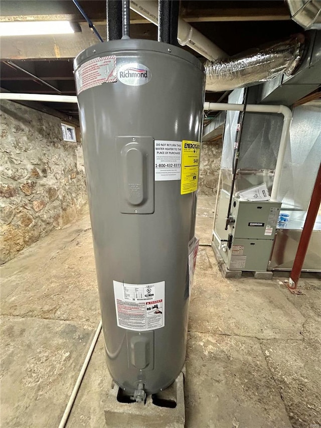 utility room with heating unit and water heater