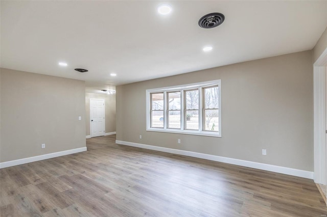 unfurnished room featuring light hardwood / wood-style floors