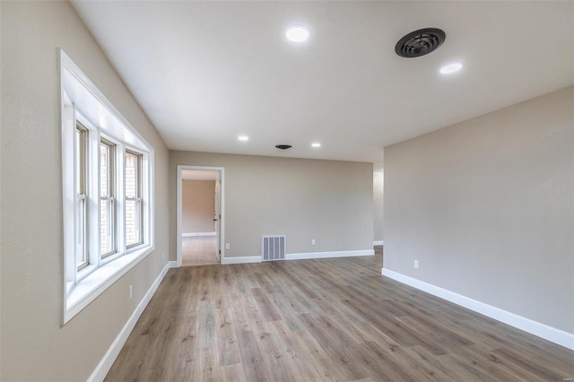 empty room with light hardwood / wood-style floors