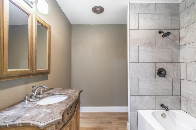 bathroom with vanity and hardwood / wood-style floors