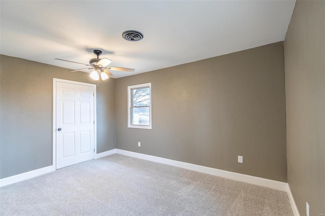 carpeted empty room with ceiling fan