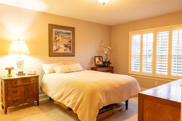 bedroom with light colored carpet